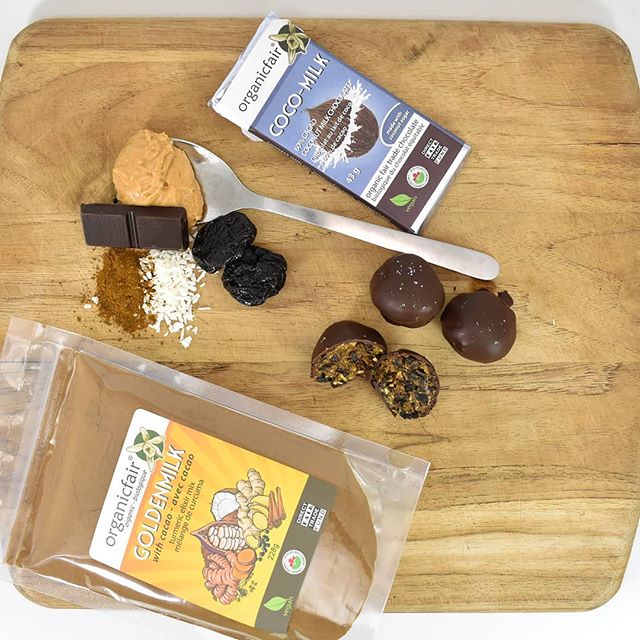 Golden Energy Bites on a plate with ingredients and goldenmilk pouch - organicfair.com