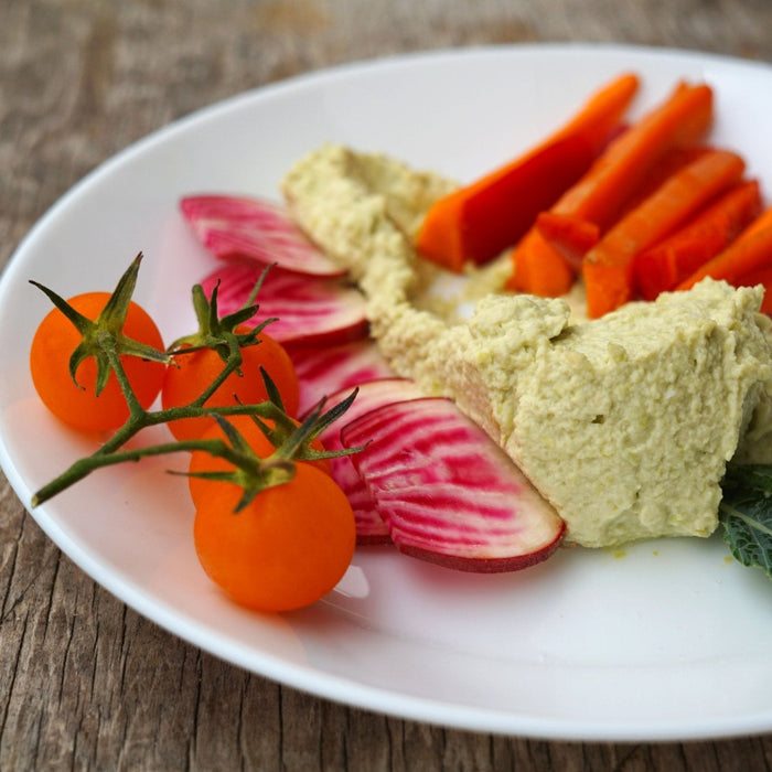 Plate of vegetables with High Protein Edamame Hummus - organicfair.com